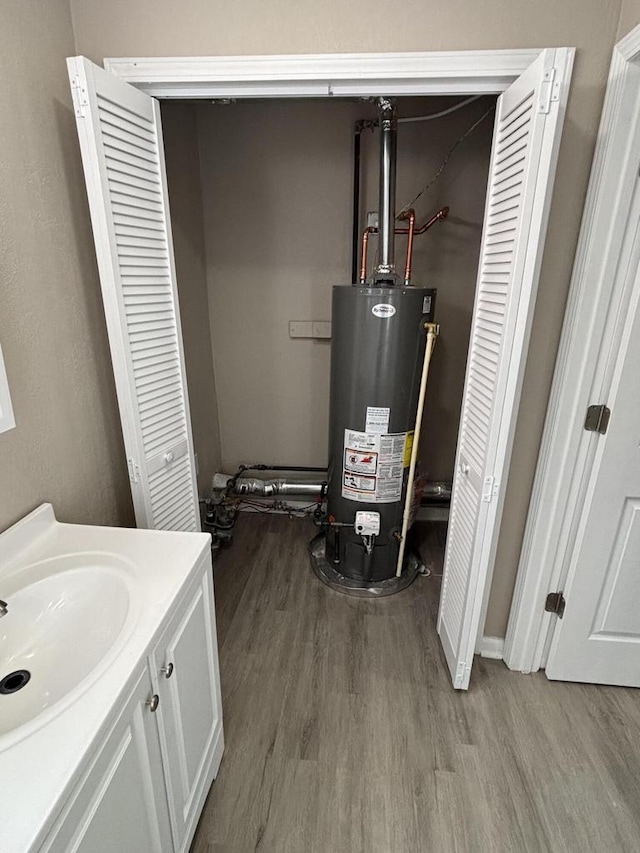 1742 Kremer Ave, Racine, WI 53402 - utility room featuring gas water heater and a sink