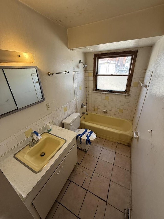 bathroom with vanity, tile patterned flooring, bathtub / shower combination, and toilet