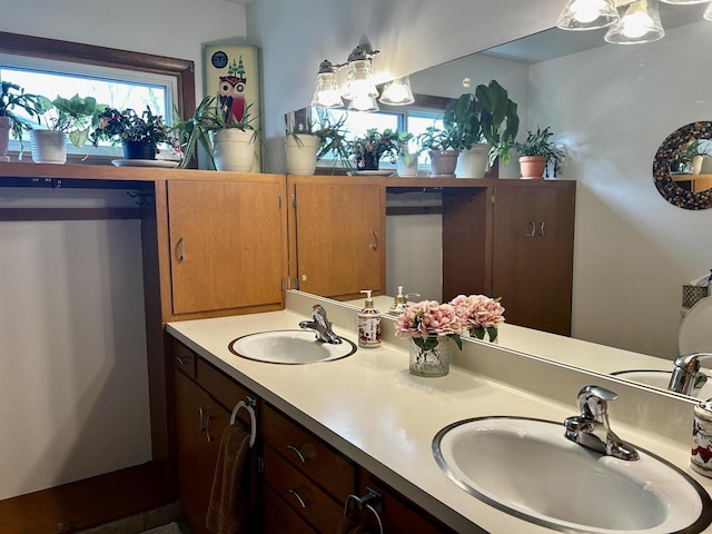 bathroom featuring double vanity and a sink