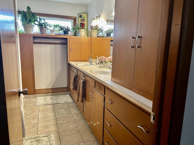 bathroom featuring a sink and double vanity