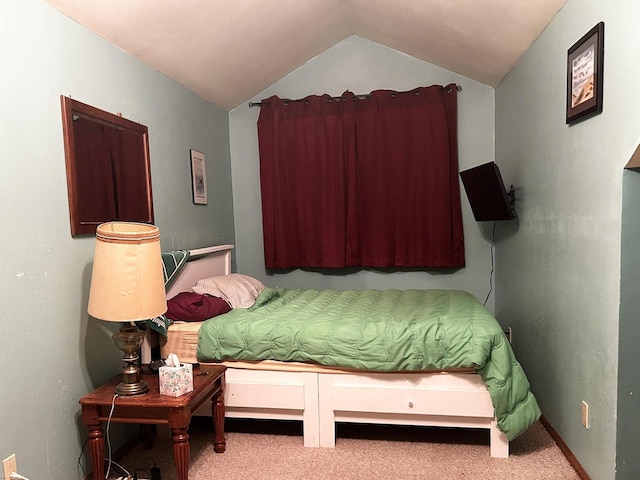 carpeted bedroom with vaulted ceiling