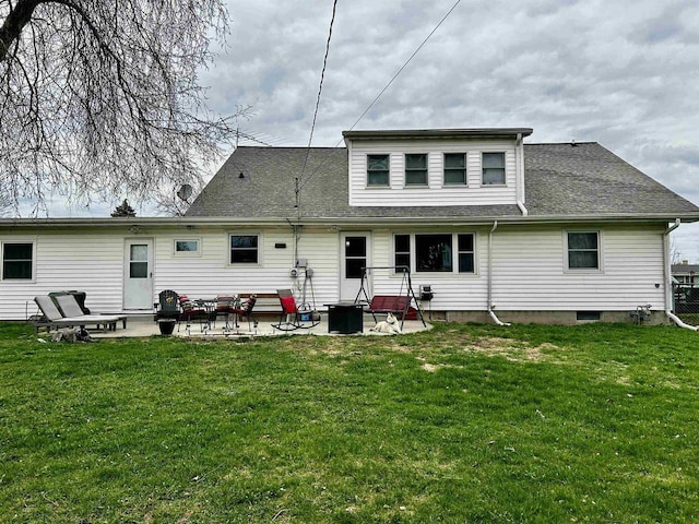 back of property featuring a lawn, a patio, and roof with shingles