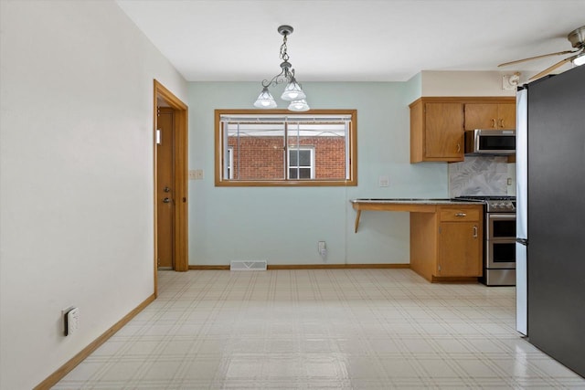 kitchen with visible vents, decorative backsplash, brown cabinetry, ceiling fan, and appliances with stainless steel finishes