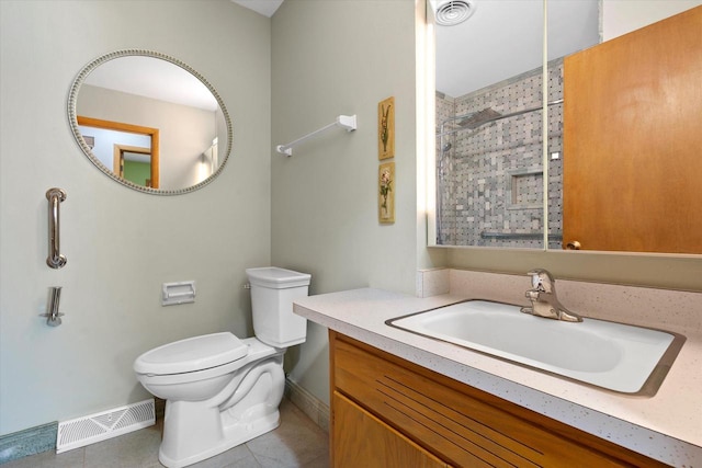bathroom featuring baseboards, tile patterned flooring, and visible vents