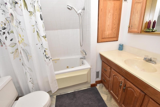 full bathroom with vanity, shower / tub combo, and toilet