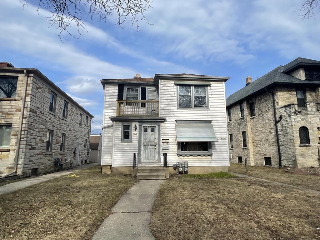 4426 W Medford Ave, Milwaukee, WI 53216 - view of front of house with a chimney and a balcony