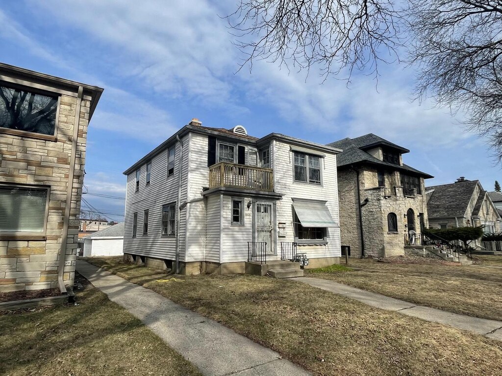 4426 W Medford Ave, Milwaukee, WI 53216 - view of front of home with a balcony and stone siding