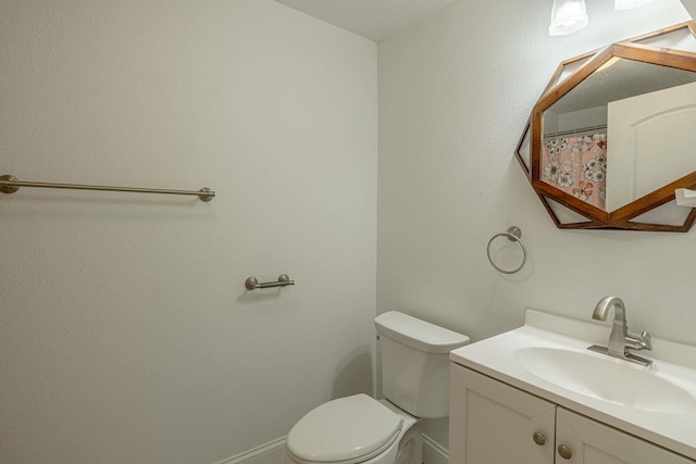 2334 16th Ave, Monroe, WI 53566 - full bathroom with vanity, toilet, and baseboards