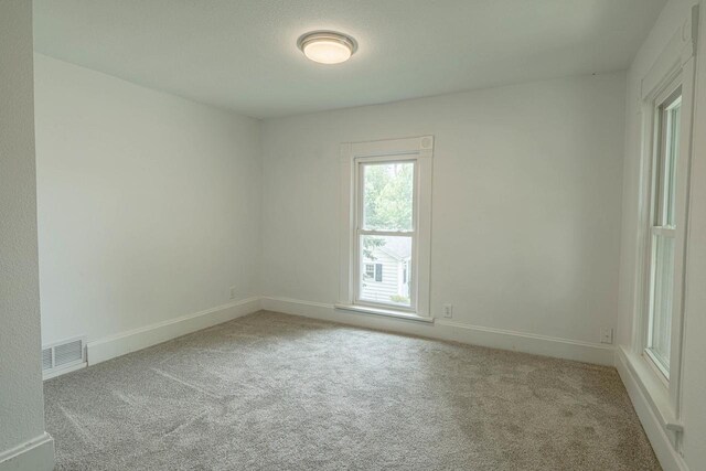 2334 16th Ave, Monroe, WI 53566 - carpeted empty room featuring baseboards