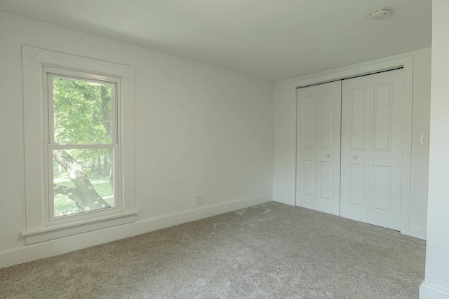 2334 16th Ave, Monroe, WI 53566 - unfurnished bedroom with carpet floors, baseboards, and a closet