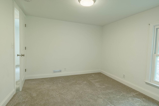 2334 16th Ave, Monroe, WI 53566 - spare room with light colored carpet and baseboards