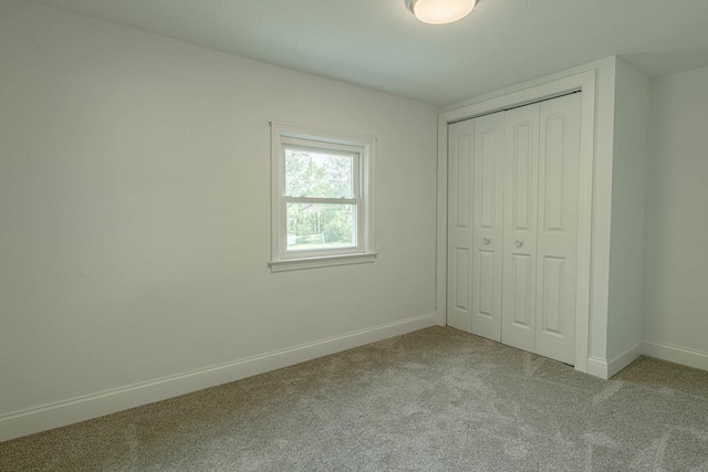 2334 16th Ave, Monroe, WI 53566 - unfurnished bedroom featuring carpet floors, baseboards, and a closet