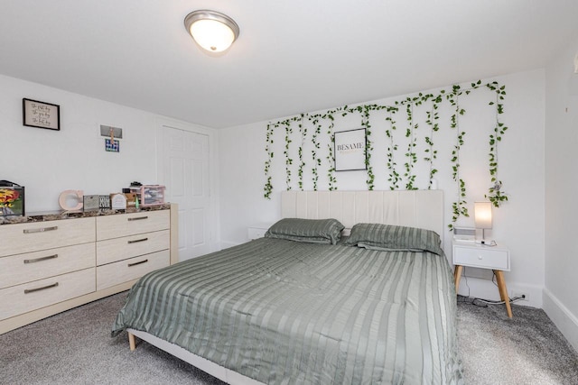 bedroom featuring baseboards and carpet flooring