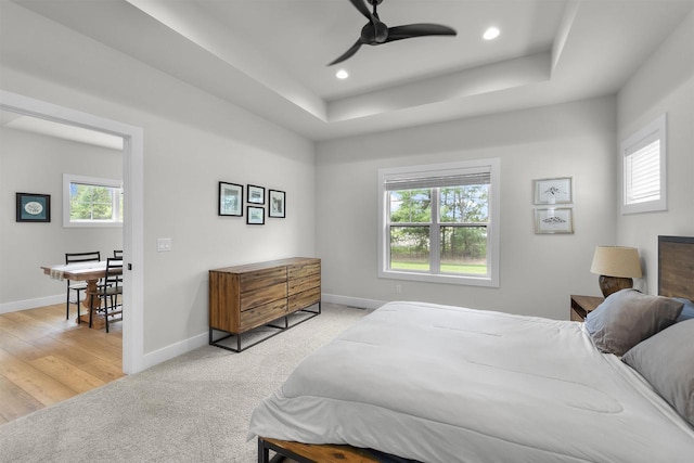 1205 Thistle Dew Ln, Waunakee, WI 53597 - bedroom with baseboards, recessed lighting, a raised ceiling, a desk, and light colored carpet