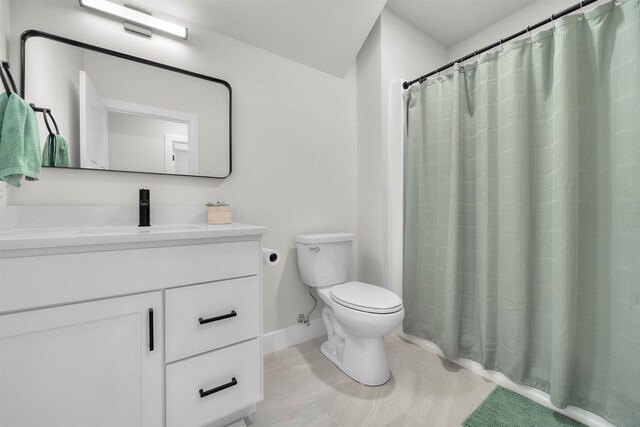 1205 Thistle Dew Ln, Waunakee, WI 53597 - bathroom with toilet, vanity, baseboards, a shower with curtain, and tile patterned flooring