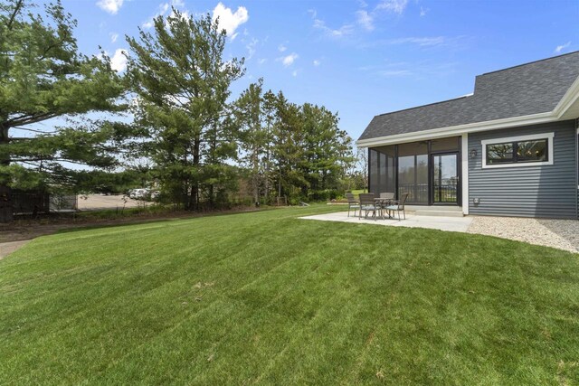 1205 Thistle Dew Ln, Waunakee, WI 53597 - view of grassy yard with a patio area and a sunroom