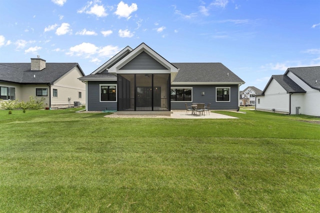 1205 Thistle Dew Ln, Waunakee, WI 53597 - rear view of property with a lawn, a patio area, and a sunroom