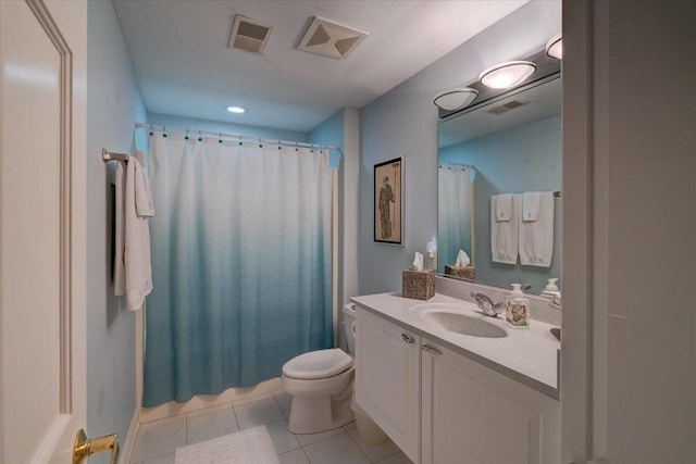 bathroom featuring visible vents, tile patterned flooring, toilet, and vanity