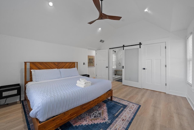 397 W Geneva St, Williams Bay, WI 53191 - bedroom with ceiling fan, a barn door, recessed lighting, baseboards, and wood finished floors