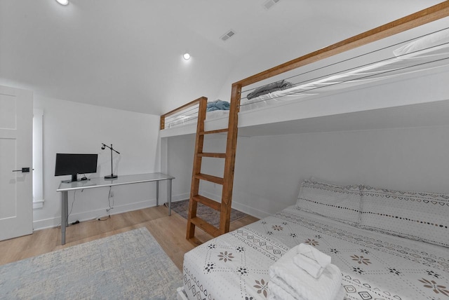 397 W Geneva St, Williams Bay, WI 53191 - bedroom featuring visible vents, lofted ceiling, and wood finished floors
