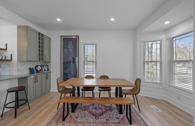 397 W Geneva St, Williams Bay, WI 53191 - dining area with visible vents, recessed lighting, light wood finished floors, and baseboards