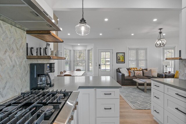 397 W Geneva St, Williams Bay, WI 53191 - kitchen with recessed lighting, white cabinetry, extractor fan, and black gas cooktop