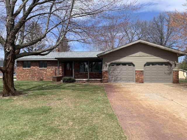 312 W Buehler Ave, Nekoosa, WI 54457 - ranch-style house featuring driveway, a front yard, roof with shingles, brick siding, and an attached garage