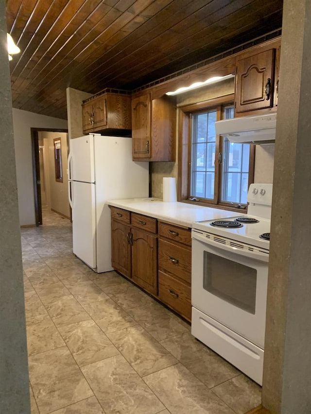 312 W Buehler Ave, Nekoosa, WI 54457 - kitchen featuring wood ceiling, brown cabinets, light countertops, under cabinet range hood, and white appliances