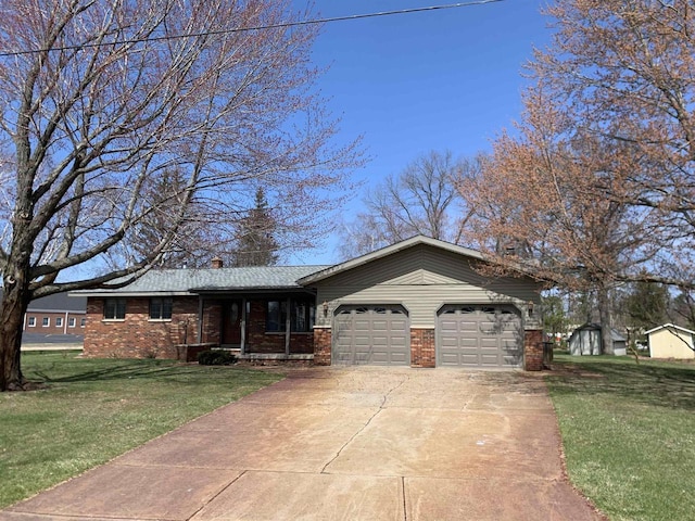 312 W Buehler Ave, Nekoosa, WI 54457 - ranch-style house with brick siding, driveway, a front lawn, and a garage