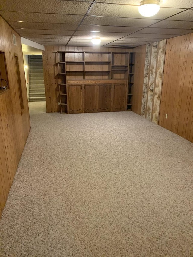 312 W Buehler Ave, Nekoosa, WI 54457 - finished basement with wooden walls, carpet floors, and stairway