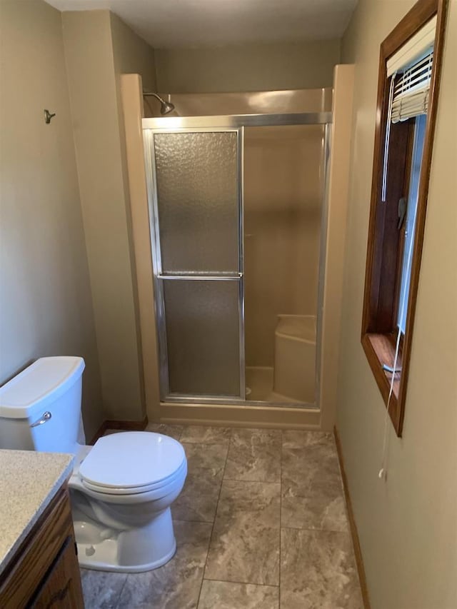 312 W Buehler Ave, Nekoosa, WI 54457 - full bath with vanity, a stall shower, and toilet