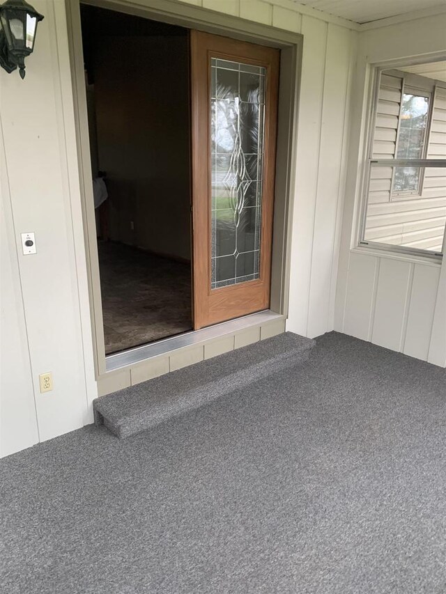 312 W Buehler Ave, Nekoosa, WI 54457 - doorway to property with board and batten siding
