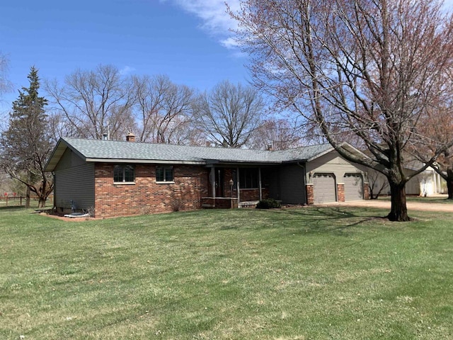 312 W Buehler Ave, Nekoosa, WI 54457 - ranch-style house with brick siding, a front lawn, an attached garage, and a chimney