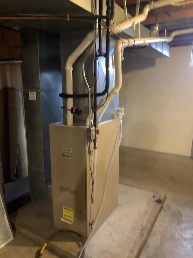312 W Buehler Ave, Nekoosa, WI 54457 - utility room featuring heating unit