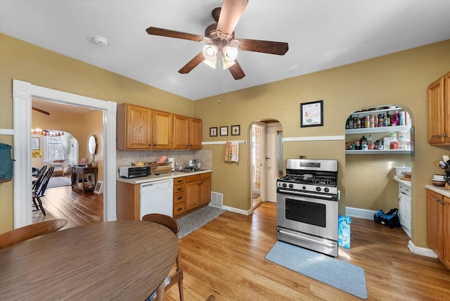 1932 N Warren Ave Unit 1934, Milwaukee, WI 53202 - kitchen featuring ceiling fan, visible vents, arched walkways, dishwasher, and stainless steel range with gas cooktop