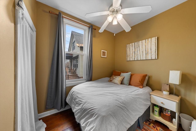 1932 N Warren Ave Unit 1934, Milwaukee, WI 53202 - bedroom featuring baseboards, a ceiling fan, and wood finished floors