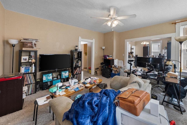1932 N Warren Ave Unit 1934, Milwaukee, WI 53202 - living area featuring carpet flooring, a textured ceiling, and ceiling fan with notable chandelier
