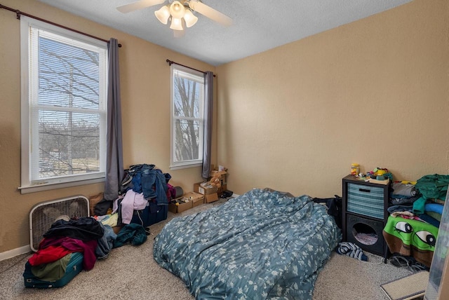 1932 N Warren Ave Unit 1934, Milwaukee, WI 53202 - carpeted bedroom with a textured ceiling and ceiling fan