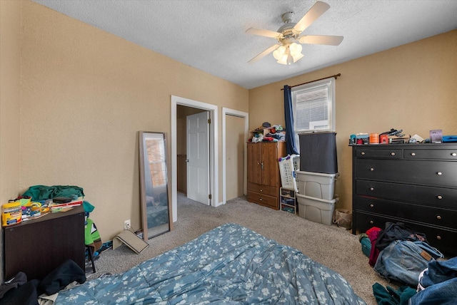 1932 N Warren Ave Unit 1934, Milwaukee, WI 53202 - carpeted bedroom with a textured ceiling and ceiling fan