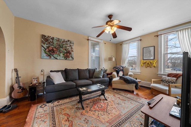 1932 N Warren Ave Unit 1934, Milwaukee, WI 53202 - living area featuring arched walkways, baseboards, a ceiling fan, and hardwood / wood-style floors
