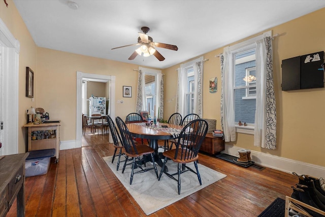 1932 N Warren Ave Unit 1934, Milwaukee, WI 53202 - dining area with baseboards, a ceiling fan, and hardwood / wood-style floors