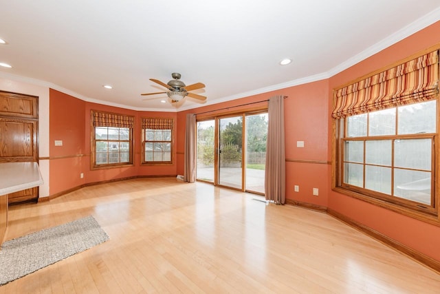 unfurnished living room featuring ornamental molding, a ceiling fan, recessed lighting, and light wood-style flooring