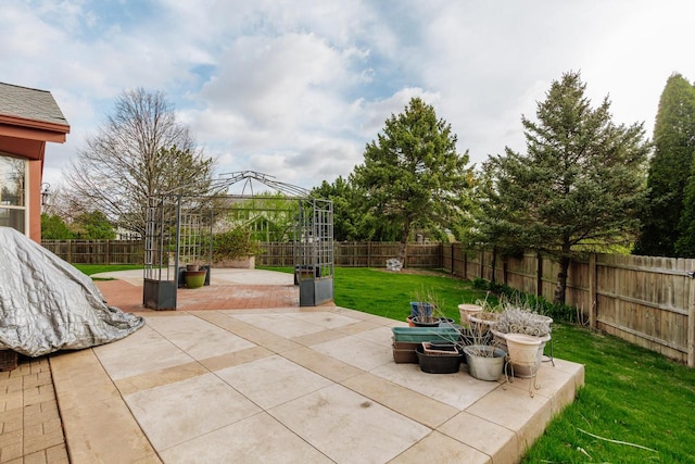 view of patio featuring a gazebo and a fenced backyard