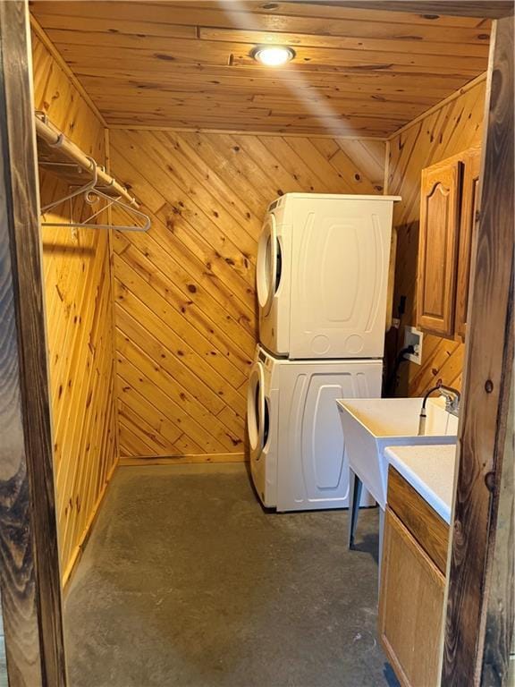 8523 Lakeside Rd, Trego, WI 54888 - laundry room featuring laundry area, a sink, wood walls, wooden ceiling, and stacked washer and clothes dryer