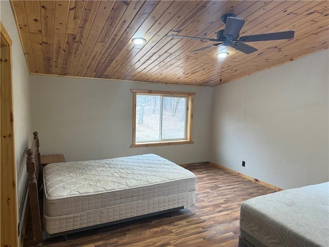 8523 Lakeside Rd, Trego, WI 54888 - bedroom with ceiling fan, wood ceiling, baseboards, and wood finished floors