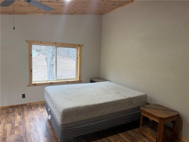 8523 Lakeside Rd, Trego, WI 54888 - bedroom with wooden ceiling, baseboards, a ceiling fan, and wood finished floors