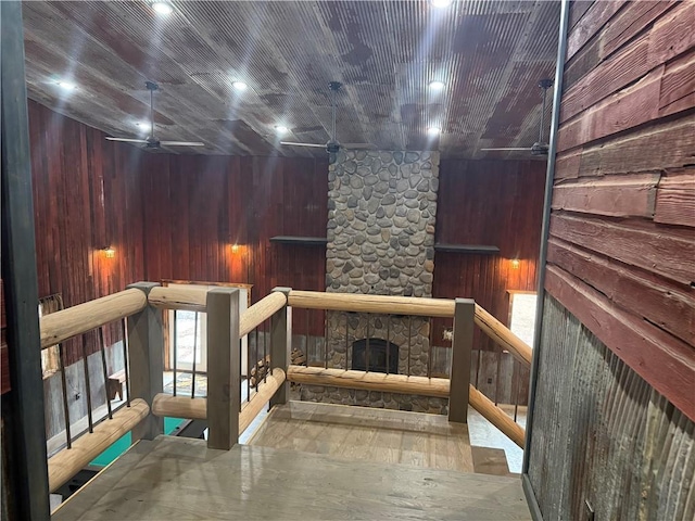 8523 Lakeside Rd, Trego, WI 54888 - interior space featuring wood walls, wood finished floors, and a fireplace