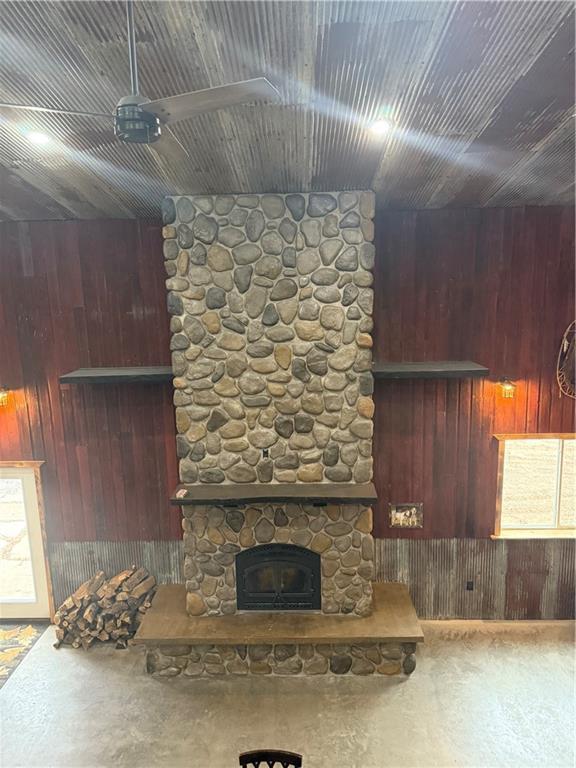 8523 Lakeside Rd, Trego, WI 54888 - interior space featuring wood walls and a stone fireplace