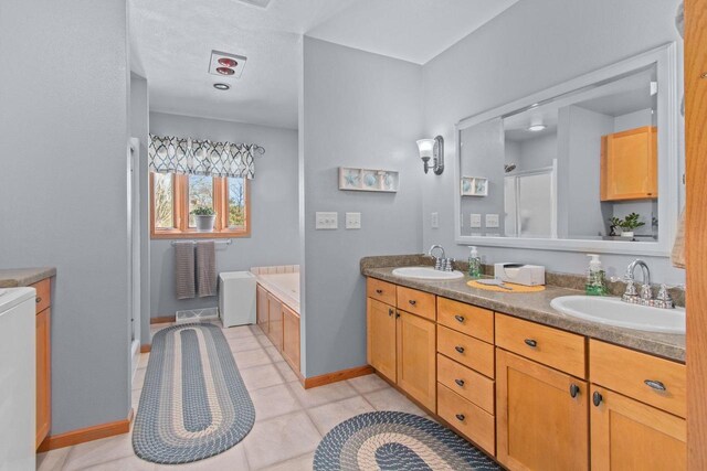E2145 Johanson Rd, Iola, WI 54945 - bathroom featuring double vanity, baseboards, and a sink