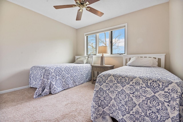 bedroom featuring carpet floors, baseboards, and ceiling fan